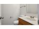 Powder room features a wood vanity with a marble countertop and modern fixtures at 10905 Amber Glow Ln, Indianapolis, IN 46229