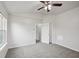 A cozy bedroom featuring neutral carpet, ceiling fan, and closet at 10905 Amber Glow Ln, Indianapolis, IN 46229