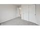 Bedroom featuring neutral walls and carpet and a double door closet at 10905 Amber Glow Ln, Indianapolis, IN 46229