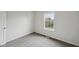 A bedroom featuring neutral walls and carpet and a bright window at 10905 Amber Glow Ln, Indianapolis, IN 46229