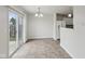 Bright dining area with tile flooring and sliding glass doors leading to the backyard at 10905 Amber Glow Ln, Indianapolis, IN 46229