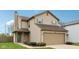 Charming two-story home features a two-car garage, green shutters, tidy landscaping and a well-maintained lawn at 10905 Amber Glow Ln, Indianapolis, IN 46229
