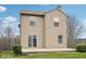 Two-story home exterior showcasing a sliding glass door and an enclosed yard at 10905 Amber Glow Ln, Indianapolis, IN 46229