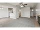 Open-concept living room with fireplace, tile flooring, and seamless flow into other rooms at 10905 Amber Glow Ln, Indianapolis, IN 46229
