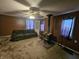 Comfortable living room with a ceiling fan, wood-burning stove, sofa and corner cabinet at 1152 W 375 N, Anderson, IN 46011