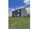 Spacious backyard with green grass and ample space at 11726 Zander Dr, Indianapolis, IN 46235