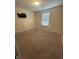 Bright bedroom features natural light and neutral carpet at 11726 Zander Dr, Indianapolis, IN 46235