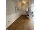 Hallway with wood floors and detailed wainscotting leading to the front door at 11726 Zander Dr, Indianapolis, IN 46235