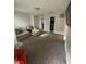 Spacious living area with plush sofa and open floor plan at 11726 Zander Dr, Indianapolis, IN 46235