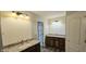 Bathroom features granite countertops, dual vanities, and modern lighting at 13648 Seven Oaks Dr, Fishers, IN 46038