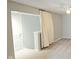 Bedroom featuring a door, privacy curtain, and ceiling fan at 13648 Seven Oaks Dr, Fishers, IN 46038