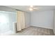 Bedroom featuring a door, privacy curtain, and ceiling fan at 13648 Seven Oaks Dr, Fishers, IN 46038