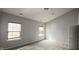 Bright bedroom with two windows, neutral carpet, and fresh paint at 13648 Seven Oaks Dr, Fishers, IN 46038