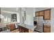Modern kitchen featuring an island, stainless steel appliances, and granite countertops at 13648 Seven Oaks Dr, Fishers, IN 46038