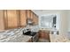 Well-appointed kitchen with stainless steel appliances, granite countertops, and a stylish tiled backsplash at 13648 Seven Oaks Dr, Fishers, IN 46038