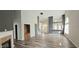 Bright living room featuring hardwood floors, open concept design, and a modern fireplace at 13648 Seven Oaks Dr, Fishers, IN 46038