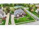 Aerial view of a stunning home with a well-manicured lawn, pool, and beautiful surroundings at 13682 Frenchmans Creek, Carmel, IN 46032