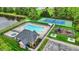 Aerial view of community pool, tennis courts, playground and surrounding trees at 13682 Frenchmans Creek, Carmel, IN 46032