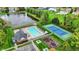 Overhead view of community pool and tennis courts, near lush landscaping and pond at 13682 Frenchmans Creek, Carmel, IN 46032