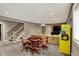 Spacious finished basement features a game table, large TV, comfortable sectional sofa and an arcade game at 13682 Frenchmans Creek, Carmel, IN 46032