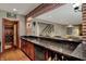 Basement wet bar offers granite countertops, sink, custom cabinets and access to the wine cellar and basement entertainment area at 13682 Frenchmans Creek, Carmel, IN 46032