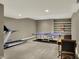 Finished basement with a carpeted floor, recessed lighting, built-in shelving, treadmill, and ping pong table at 13682 Frenchmans Creek, Carmel, IN 46032