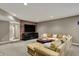The finished basement features a large TV and entertainment center, and a comfortable sectional sofa at 13682 Frenchmans Creek, Carmel, IN 46032