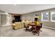 The finished basement features a large sectional, wood accent wall, entertainment center, and a fun arcade game at 13682 Frenchmans Creek, Carmel, IN 46032