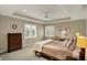 Bright bedroom featuring large windows, ceiling fan, and tasteful decor at 13682 Frenchmans Creek, Carmel, IN 46032