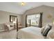 Cozy bedroom with a view of the exterior and classic furniture at 13682 Frenchmans Creek, Carmel, IN 46032