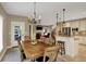 Open-concept design featuring a dining area that flows into the kitchen and living spaces at 13682 Frenchmans Creek, Carmel, IN 46032