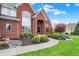 Beautiful brick home with manicured landscaping and a curved walkway leading to the front door at 13682 Frenchmans Creek, Carmel, IN 46032