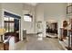 Grand foyer with soaring ceilings, tile flooring, and elegant staircase to the second floor at 13682 Frenchmans Creek, Carmel, IN 46032
