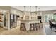 Bright eat-in kitchen features a large island with seating and stainless steel appliances at 13682 Frenchmans Creek, Carmel, IN 46032