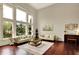 Elegant living room boasts soaring ceilings and large windows with beautiful outdoor views at 13682 Frenchmans Creek, Carmel, IN 46032