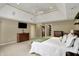 Large main bedroom with a tray ceiling, ample closet space, and stylish decor at 13682 Frenchmans Creek, Carmel, IN 46032