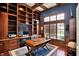 Executive office featuring custom built-ins, hardwood floors, and plenty of natural light at 13682 Frenchmans Creek, Carmel, IN 46032
