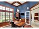 Charming home office with a rich wood desk, built-in shelving, and natural light at 13682 Frenchmans Creek, Carmel, IN 46032