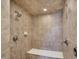 Custom tiled shower features dual shower heads, built-in seat, and convenient controls at 13682 Frenchmans Creek, Carmel, IN 46032