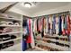 Organized walk-in closet with shelving, rods, and dedicated space for shoes and accessories at 13682 Frenchmans Creek, Carmel, IN 46032