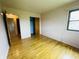 Bright bedroom with hardwood floors and closet space, offering a serene and organized living space at 1387 W Furry Rd, Fountaintown, IN 46130