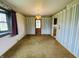 This dining room offers vintage wallpaper, a wood door, and a retro chandelier at 1387 W Furry Rd, Fountaintown, IN 46130