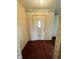 Entryway featuring patterned wallpaper, tile flooring, and a white front door with a window at 1387 W Furry Rd, Fountaintown, IN 46130
