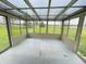 Enclosed sunroom with large windows and natural light, perfect for relaxation and enjoying the outdoors at 1387 W Furry Rd, Fountaintown, IN 46130