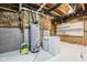 Unfinished basement area with exposed pipes, a water heater, shelving, and concrete flooring at 14814 Edgebrook Dr, Fishers, IN 46040