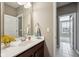 Well-lit bathroom featuring a single sink vanity, neutral color walls, and tiled floors in neutral colors at 14814 Edgebrook Dr, Fishers, IN 46040