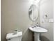 Powder room with pedestal sink and modern fixtures at 14814 Edgebrook Dr, Fishers, IN 46040