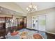 Open-concept dining area with modern chandelier and sliding door access to the patio at 14814 Edgebrook Dr, Fishers, IN 46040