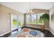 Open-concept dining area with modern chandelier and sliding door access to the patio at 14814 Edgebrook Dr, Fishers, IN 46040
