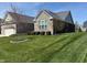 Charming single-story home with a well-manicured lawn and stone facade at 14814 Edgebrook Dr, Fishers, IN 46040